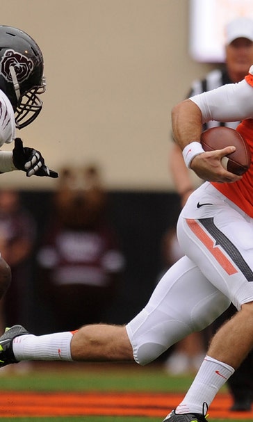 Oklahoma State QB J.W. Walsh leaves early with lower leg injury
